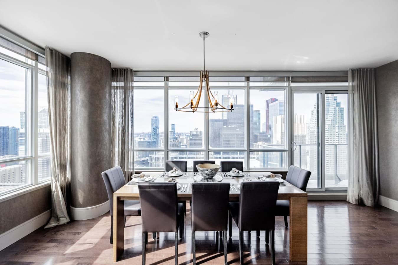 Dining area with floor-to-ceiling windows and downtown views