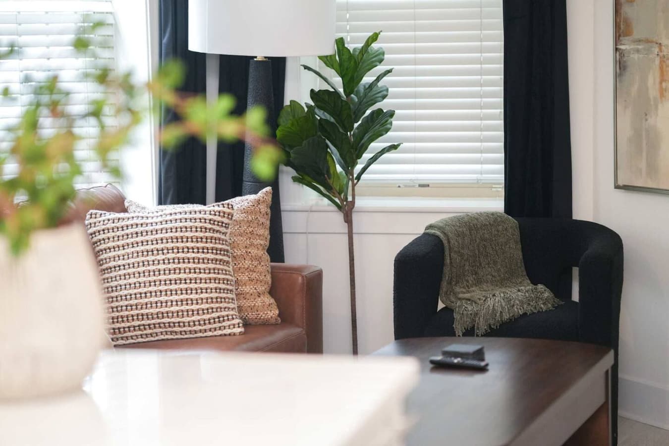 Warm, styled living corner of a Washington, D.C. suite