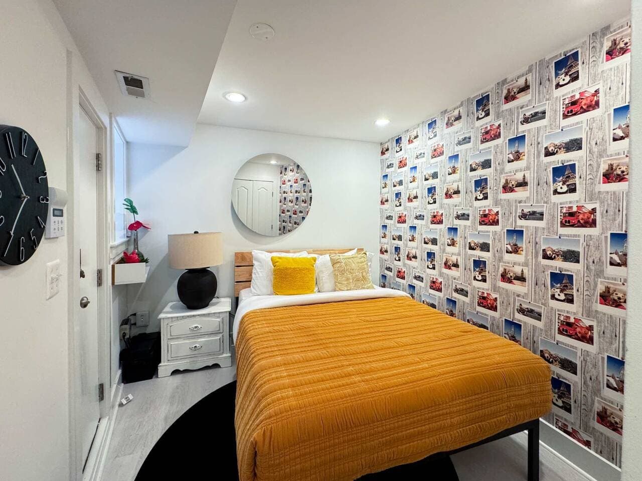 Bedroom with a playful photo-collage accent wall